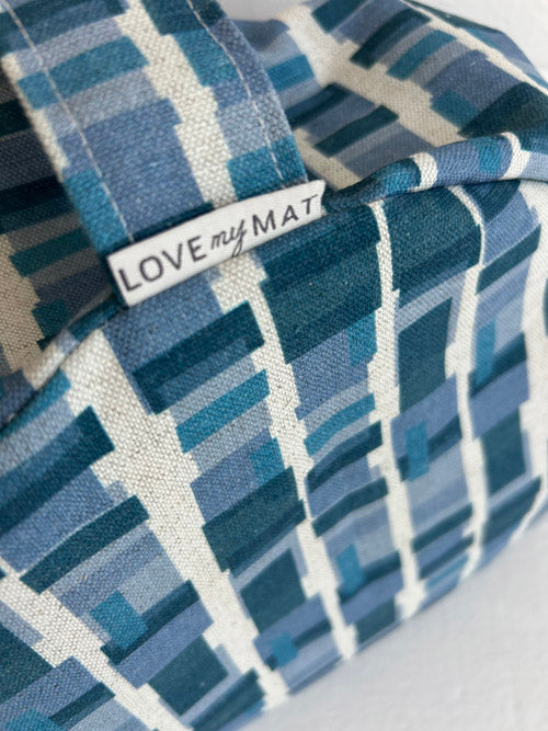 Blue patterned meditation cushion with 'LOVE my MAT' label on a white background