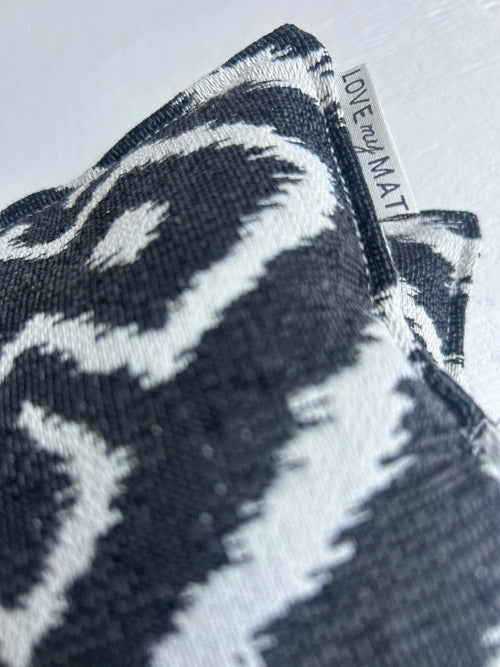 Textured black and white mat with 'LOVE MY MAT' label on a light gray background