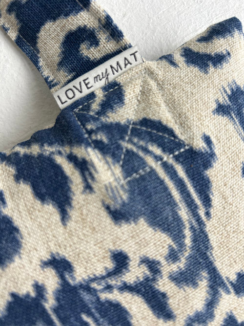 Fabric sandbag with blue and white pattern and 'LOVE my MAT' label.