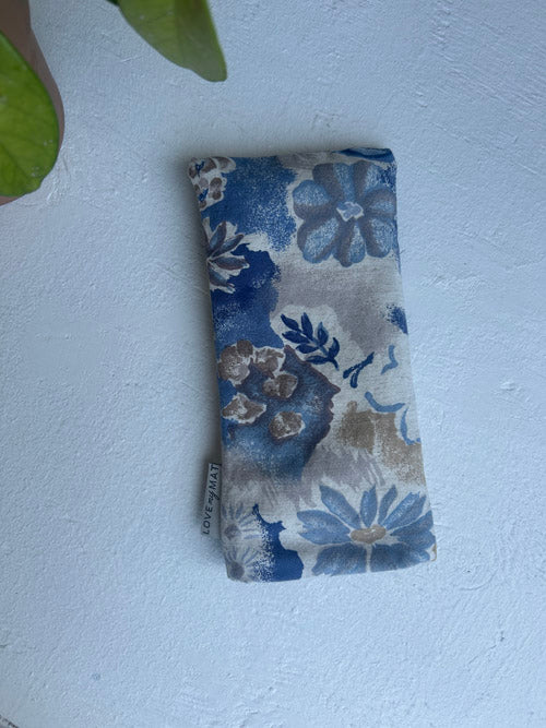 Floral patterned pouch on a white surface
