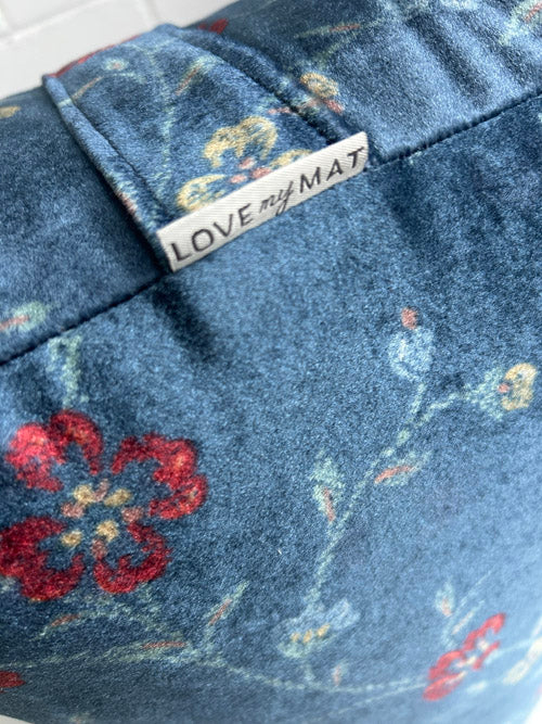 Blue Velour type fabric Yoga Bolster on white background