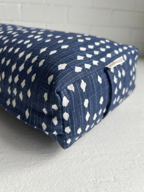 Navy blue fabric with white pattern on a white surface
