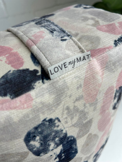 Floral-patterned yoga bolster with a 'LOVE my MAT' label on a white background