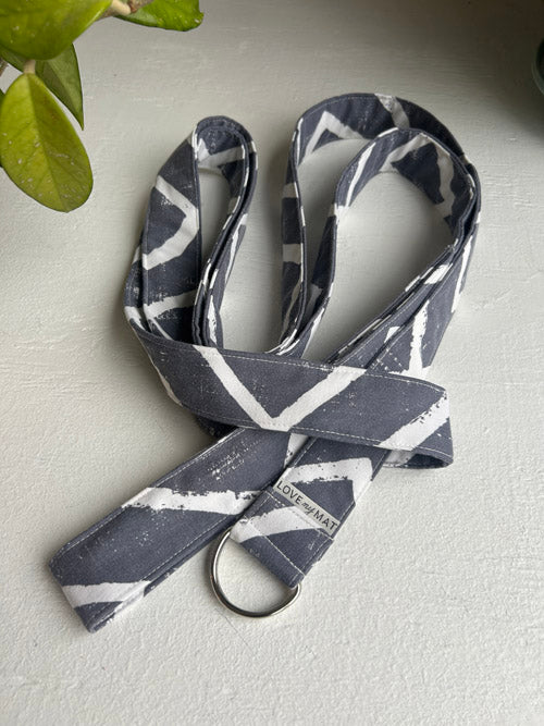 Fabric Yoga Strap with a pattern on a light surface