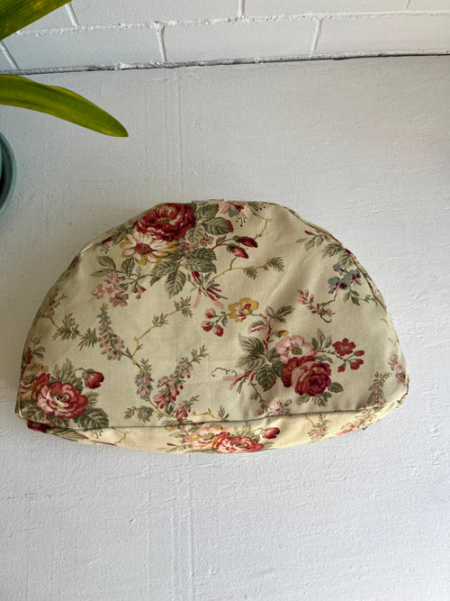 Floral-patterned fabric meditation cushion  on a white surface