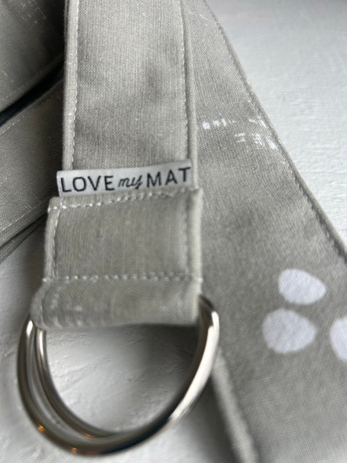Gray mat with a metal ring and 'LOVE my MAT' tag on a light gray background