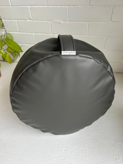 Round gray meditation cushion with 'LOVE MY MAT' label on a white surface.