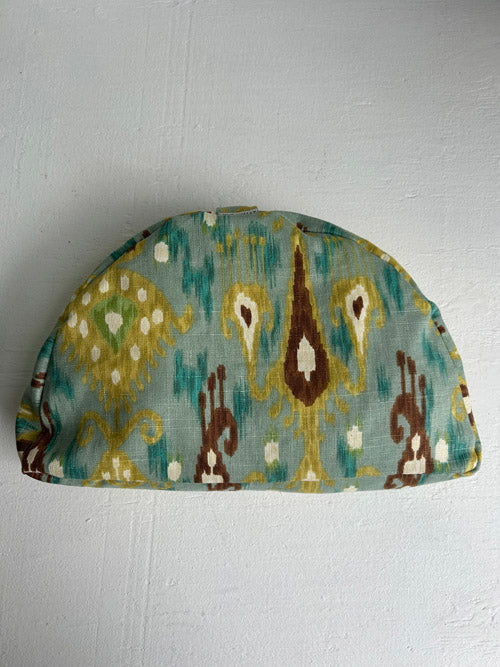 Decorative fabric meditation cushion with a pattern on a white background