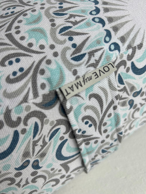 Close up of a teal, blue and grey pattern on a white background Yoga Bolster