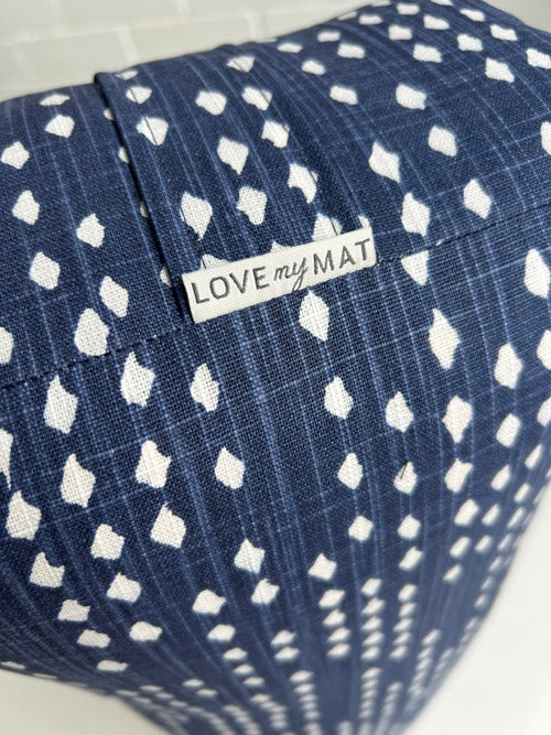Blue and white print long yoga bolster  with a 'LOVE my MAT' label.