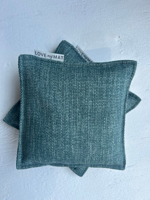 Two green fabric bags with 'LOVE MY MAT' label on a white background