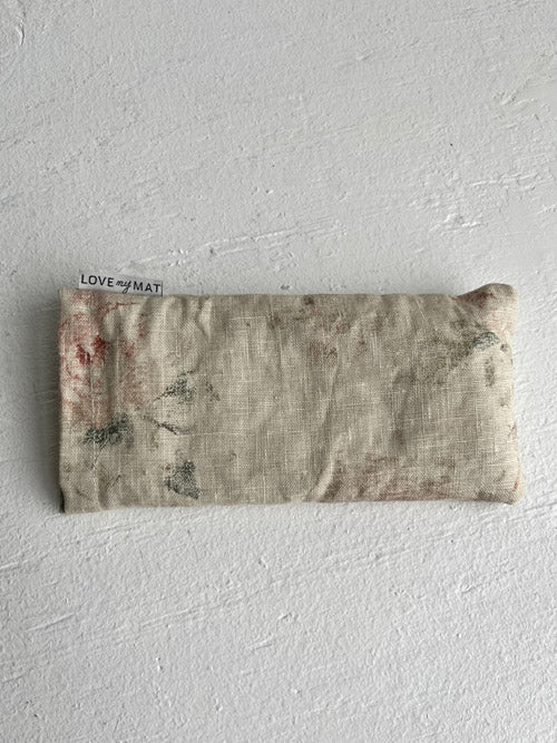 Textured fabric pouch with 'LOVE OF MAT' label on a white background