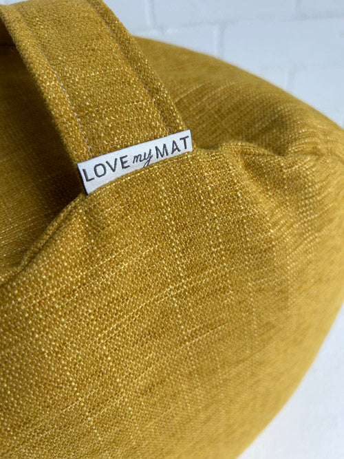 Golden Yellow Meditation floor cushion with 'LOVE my MAT' label on a white background